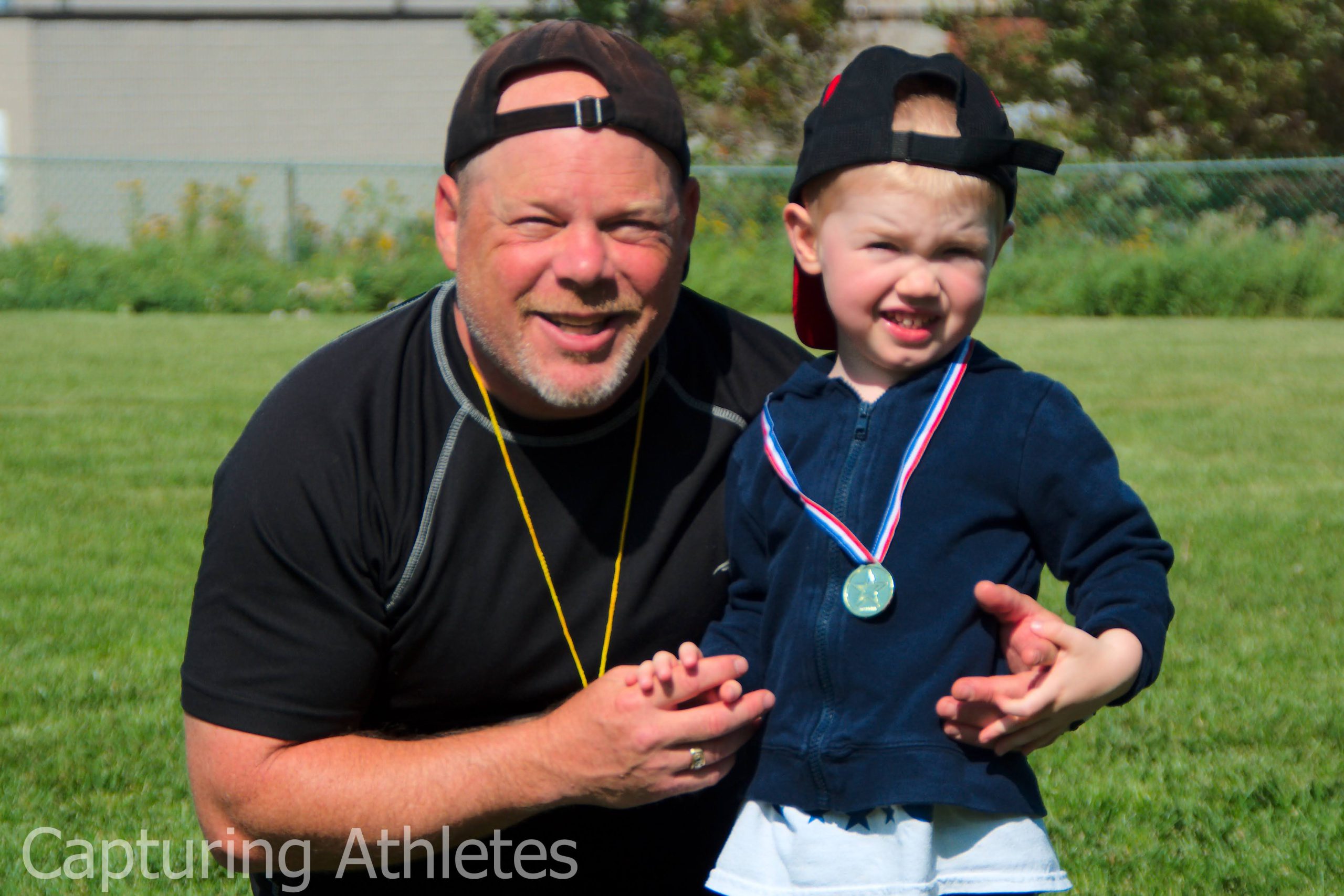Coach Steve with child who won a medal